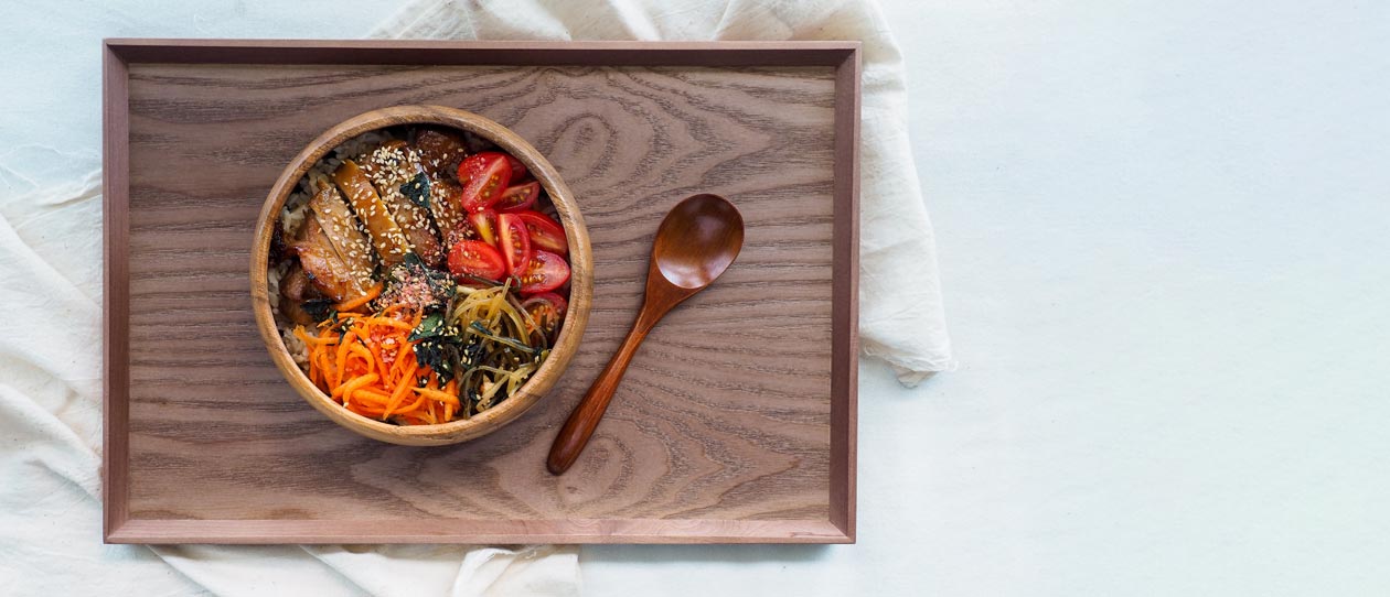 Bowl of vegetables, chicken and noodles on a tray