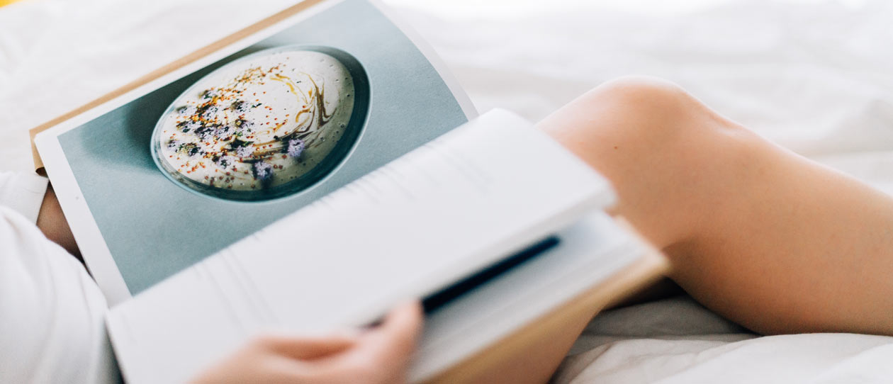 Woman reading a recipe book