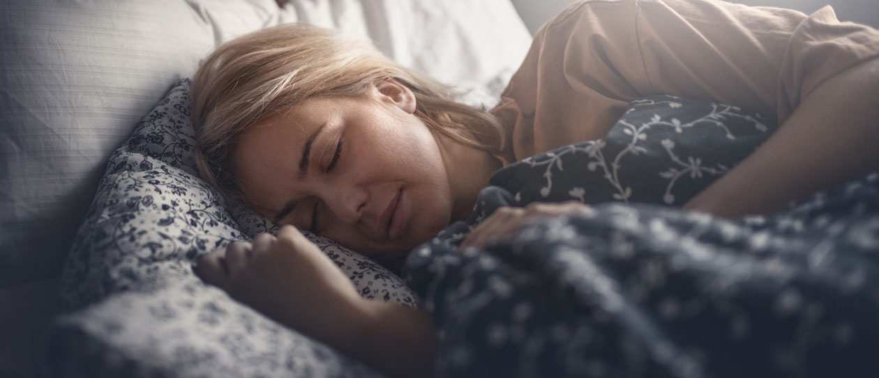 Woman asleep, lying on her side